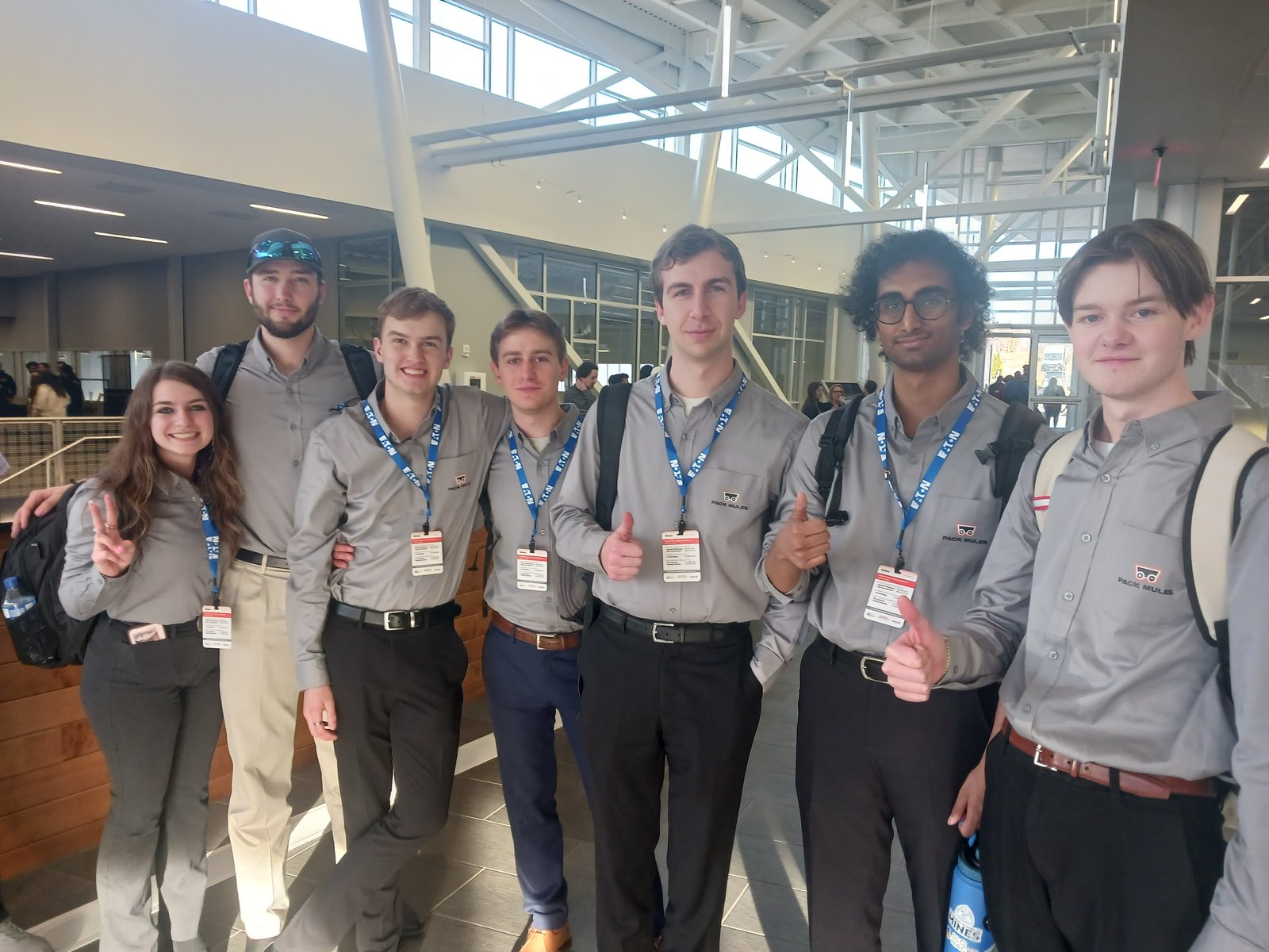 Mines and Arapahoe Community College Battery Workforce Challenge team in the shop