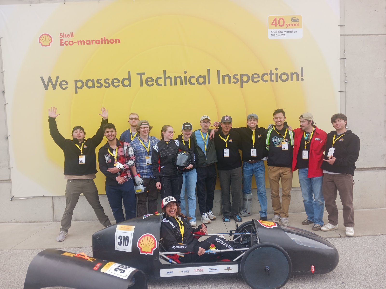 Shell Eco-marathon team celebrating passing technical inspection